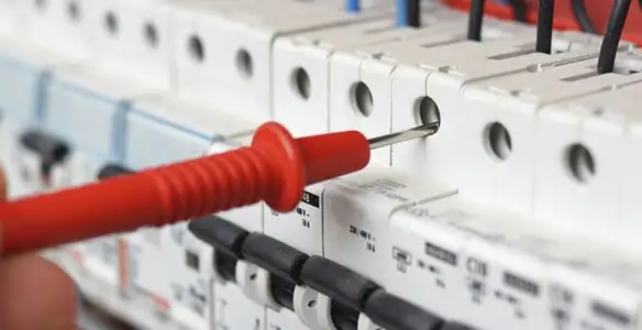 Electrical contractor testing circuit breakers during electrical repair in Sedalia, CO