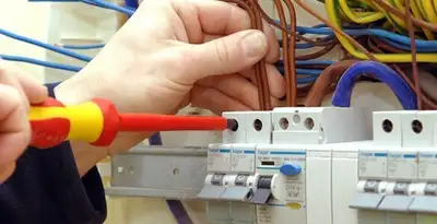 electrician services performing professional electrical panel wiring and connections in Littleton, CO