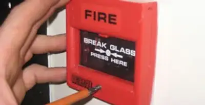 fire alarm installation service showing manual fire alarm pull station installed by licensed electricians in Littleton, CO