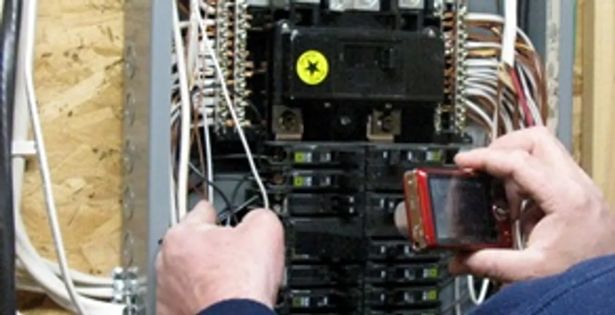 Home electrical inspection of circuit breaker panel by licensed electrician in Littleton, CO