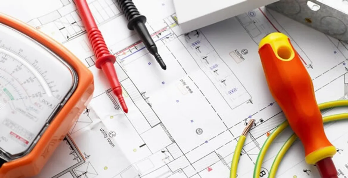 licensed electrician planning and testing electrical systems using professional tools in Littleton, CO